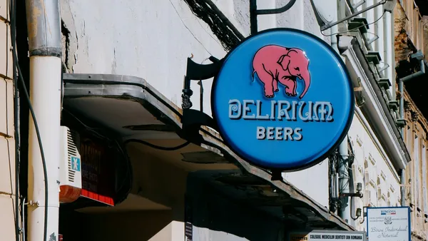Letrero circular azul de Delirium Beers